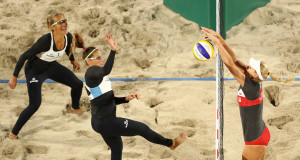 RIO DE JANEIRO, BRAZIL - AUGUST 10: Georgina Klug spikes as Ana Gallay of Argentina looks as Marketa Slukova of Czech Republic blocks at the net during the Beach Volleyball - Women's Preliminary - Pool B, Match 26 on Day 5 of the Rio 2016 Olympic Games at the Beach Volleyball Arena on August 10, 2016 in Rio de Janeiro, Brazil. (Photo by Paul Gilham/Getty Images)