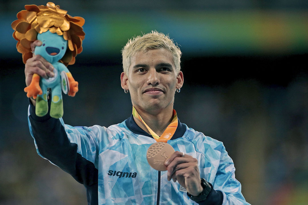 RIO DE JANEIRO, BRAZIL - SEPTEMBER 09: Bronze medalist Hernan Barreto of Argentina celebrates on the podium at the medal ceremony for the Menâs 100m â T35 Final during day 2 of the Rio 2016 Paralympic Games at the Olympic Stadium on September 9, 2016 in Rio de Janeiro, Brazil. (Photo by Alexandre Loureiro/Getty Images)