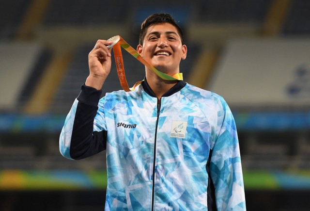 RIO DE JANEIRO, BRAZIL - SEPTEMBER 12: Silver medalist Hernan Emanuel Urra of Argentina celebrates on the podium at the medal ceremony for the Mne's Shot Put - F35 on day 5 of the Rio 2016 Paralympic Games at the Olympic Stadium on September 12, 2016 in Rio de Janeiro, Brazil. (Photo by Atsushi Tomura/Getty Images for Tokyo 2020)