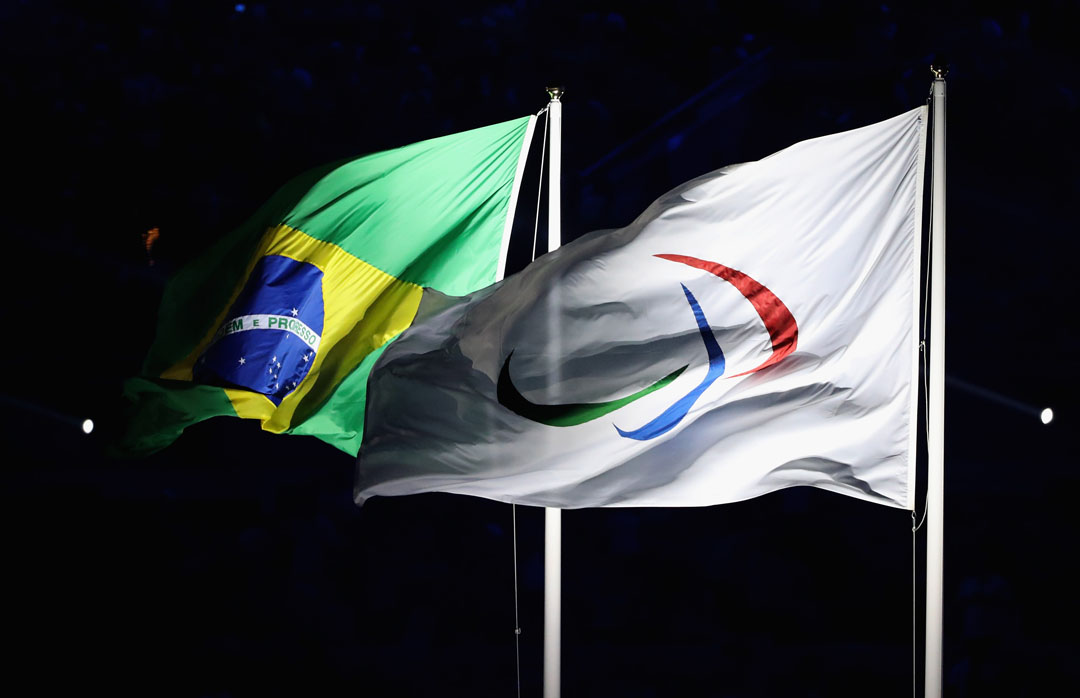 RIO DE JANEIRO, BRAZIL - SEPTEMBER 07: (R-L)The flags of the International Paralympic Committee and of Brazil fly during the Opening Ceremony of the Rio 2016 Paralympic Games at Maracana Stadium on September 7, 2016 in Rio de Janeiro, Brazil. (Photo by Friedemann Vogel/Getty Images)