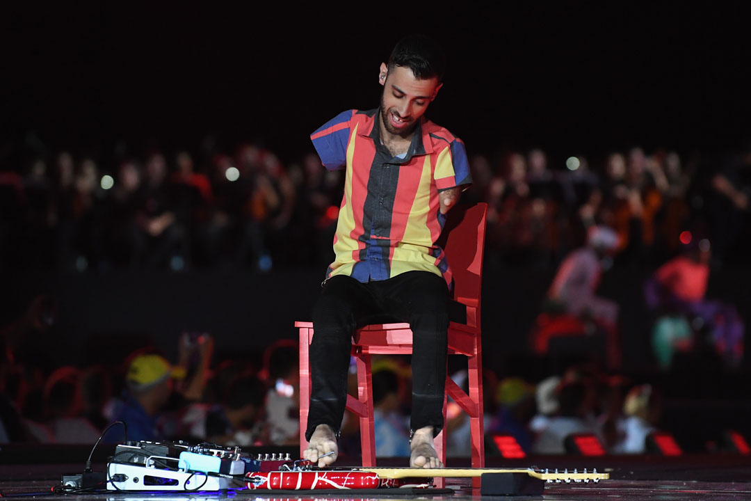 RIO DE JANEIRO, BRAZIL - SEPTEMBER 18: Musician Johnatha Bastos plays electric guitar with his feet during the closing ceremony of the Rio 2016 Paralympic Games at Maracana Stadium on September 18, 2016 in Rio de Janeiro, Brazil. (Photo by Atsushi Tomura/Getty Images for Tokyo 2020)